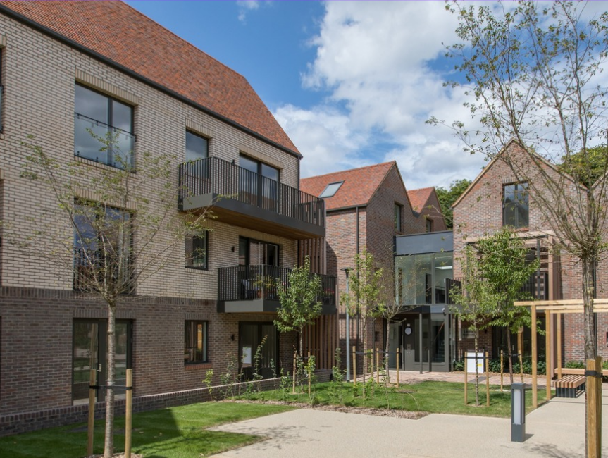 Courtyard of modern brick townhomes at Rivulet